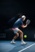 Hero image of Ben Johns with Perseus Pro V in hand about to hit a ball.