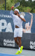 Image of JOOLA pro Chuck Taylor mid-swing with new JOOLA Pro IV pickleball paddle in hand.