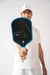 Ben Johns holding the JOOLA Hyperion CFS in his hand, upfront.