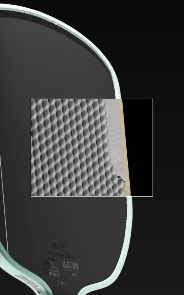 Close up on the detailed honeycomb core inside a JOOLA Graf Pro V.