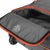 White Background Image: Charcoal colored vision suitcase. Orange zipper area, close up on pocket for shoes.