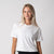 Image of female model wearing a JOOLA Women's Court Crop Tee, White.