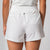 Image showing the back of a pair of JOOLA Women's Woven Shorts on the body of a female model, white.