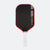 Pickleball paddle with black surface, red edges, and white handle on a white background