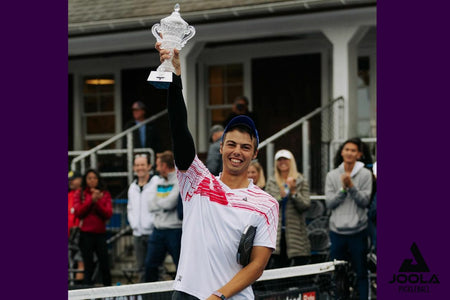 Ben Johns holding his trophy