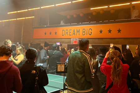 Players gather in front of the mezzanine at the 2025 Marty Invitational Ping Pong tournament