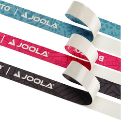 White background, product image showing all three colors of JOOLA x Britto edge guard tape. Category