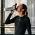 JOOLA Pro Simone Jardim drinking out of the white and black JOOLA water bottle.