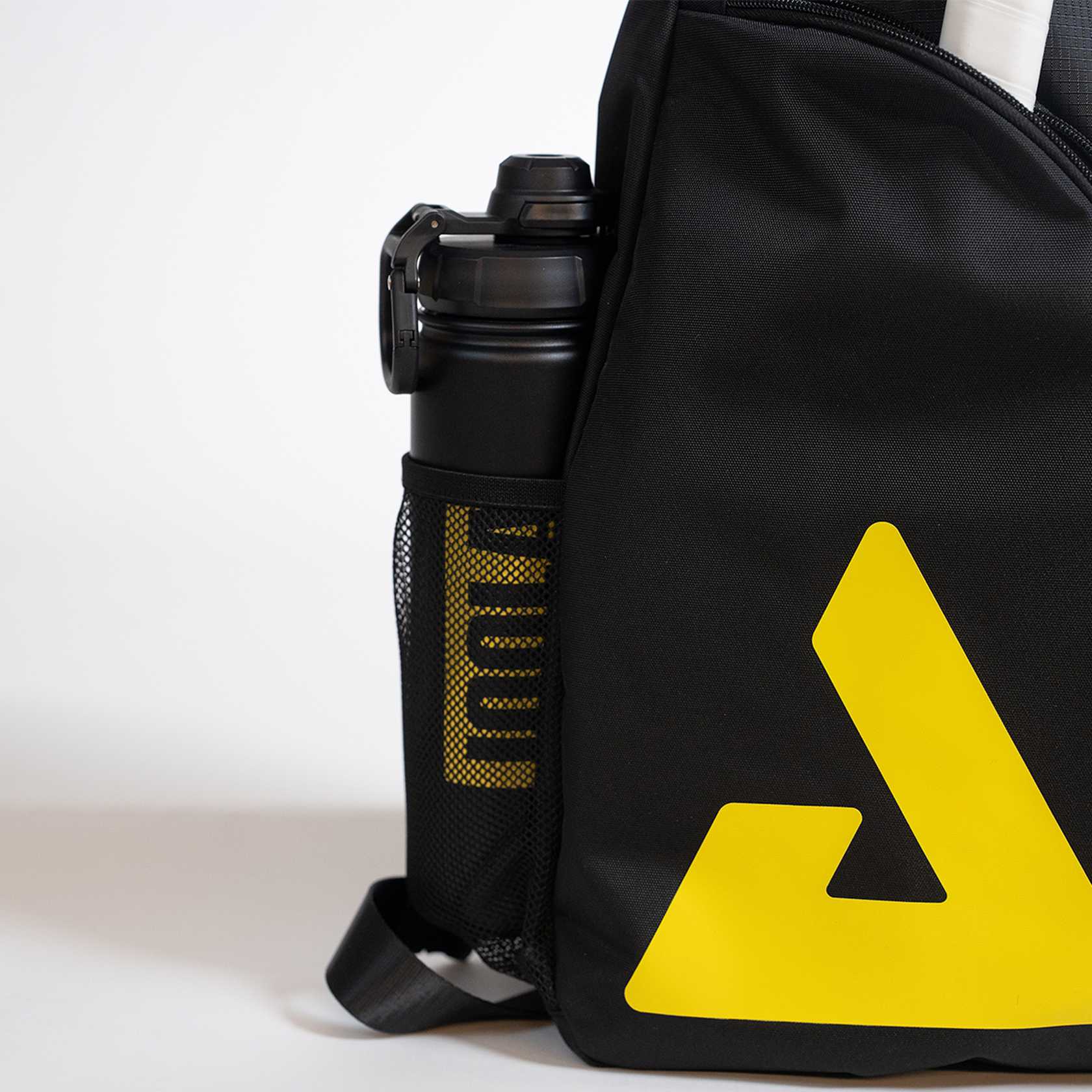 Black bag with a yellow logo and a black water bottle inside on a white background