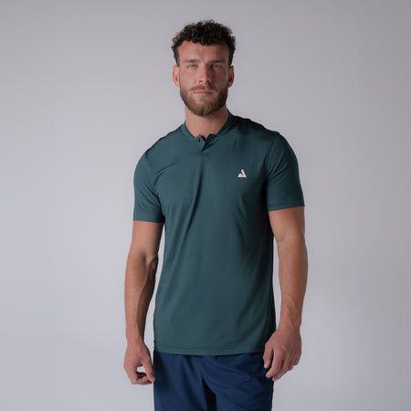 Image showing a male model wearing a JOOLA men's court polo, club green.