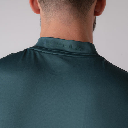 Image showing the JOOLA logo on the collar of a JOOLA men's polo, green.