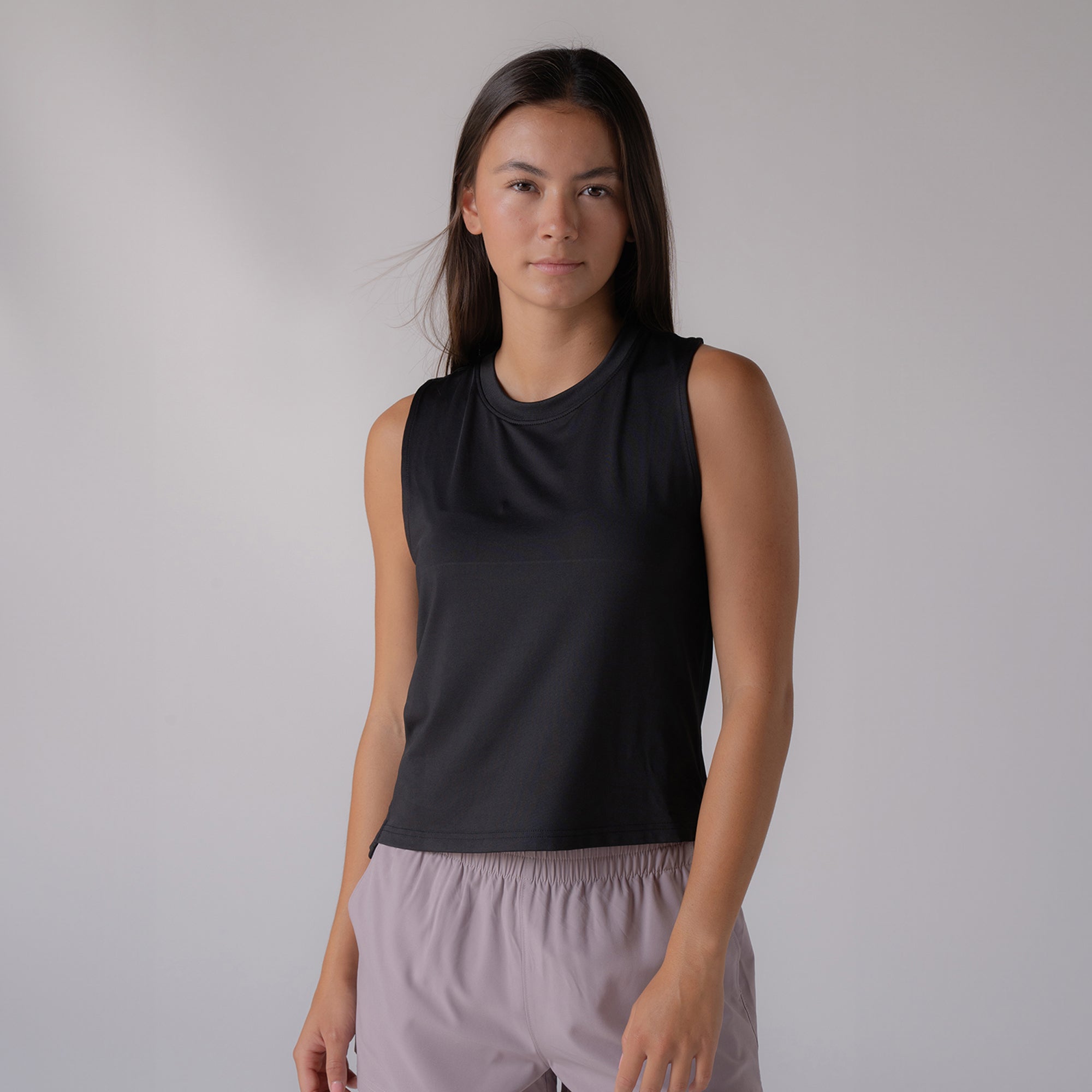 Image of a model wearing a JOOLA women's court tank top, black.