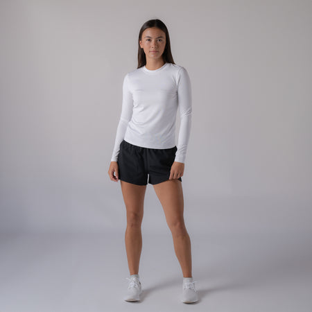 Image of a model wearing the a pair of black JOOLA women's woven shorts.