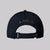 The back view of a black JOOLA essential hat with adjustable strap.