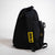 Black backpack with yellow 'Joola' logo on a white background