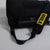 Black bag with a yellow strap featuring the 'JOOLA' brand on a light gray background