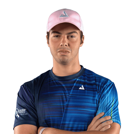 Image of Ben Johns wearing a light pink JOOLA trinity hat. #Light Pink