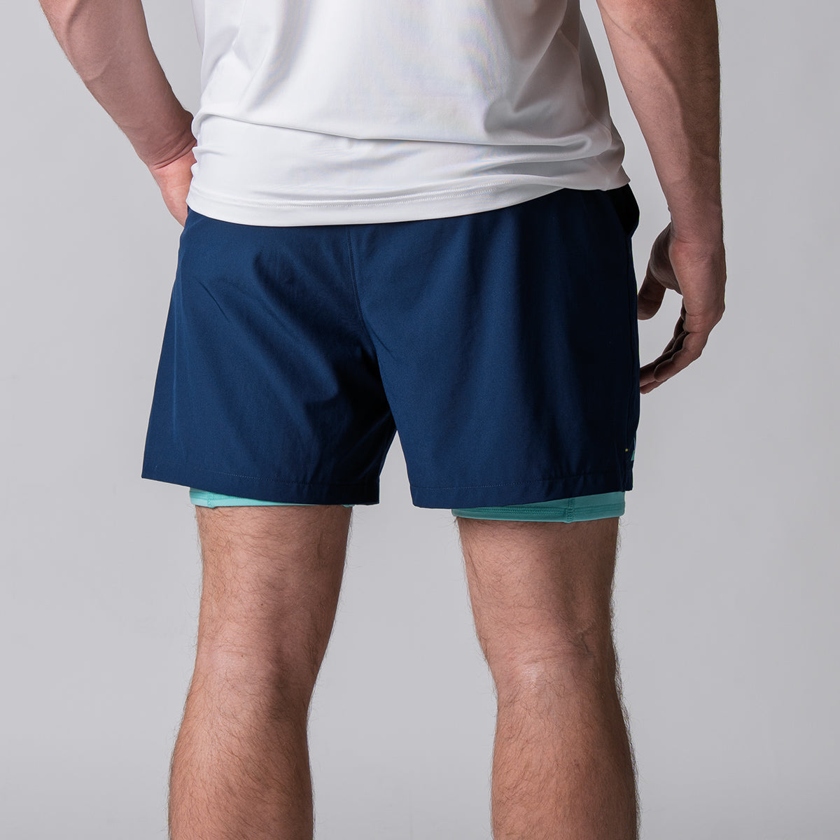 Image of the back of a pair of JOOLA Men's 2 in 1 shorts, navy.