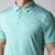 Close up image of a JOOLA men's club polo, tropical tide heather.