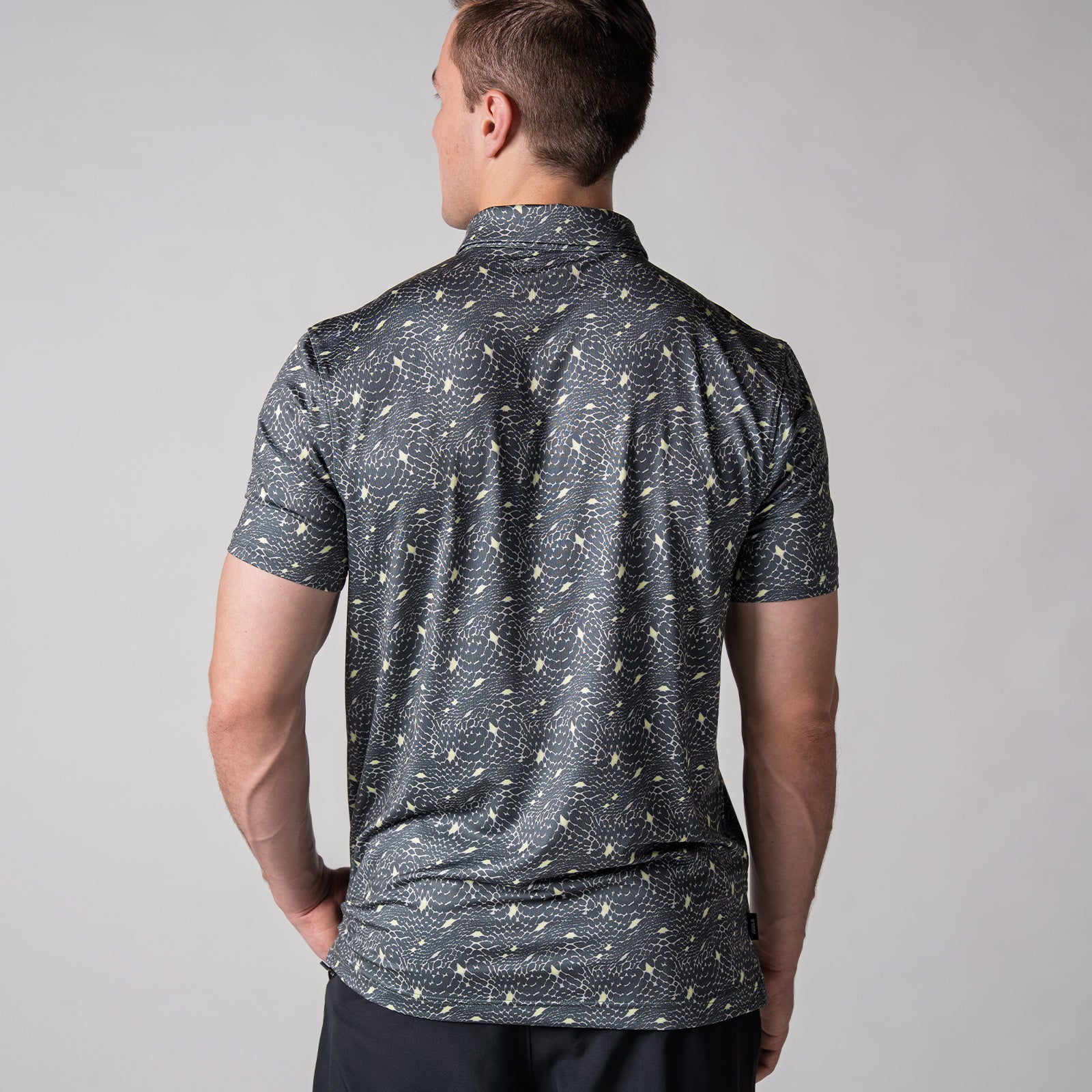 Image of the back of a JOOLA men's club printed polo, serpentine charcoal print.