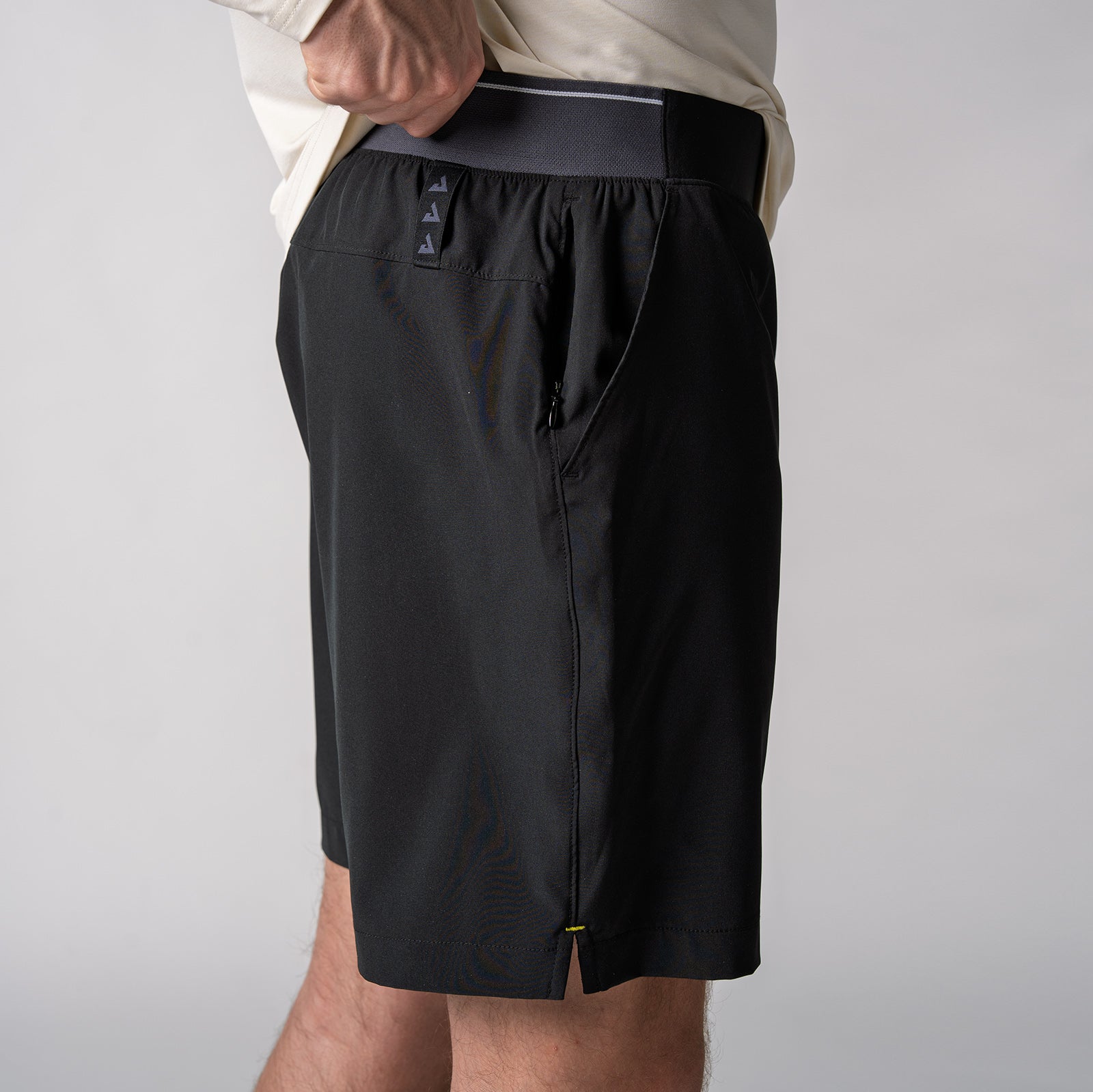 Image of the side of a pair of JOOLA men's club shorts, black.