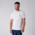 White background, image of a male model wearing a JOOLA Men's Court Short Sleeve Shirt, white.