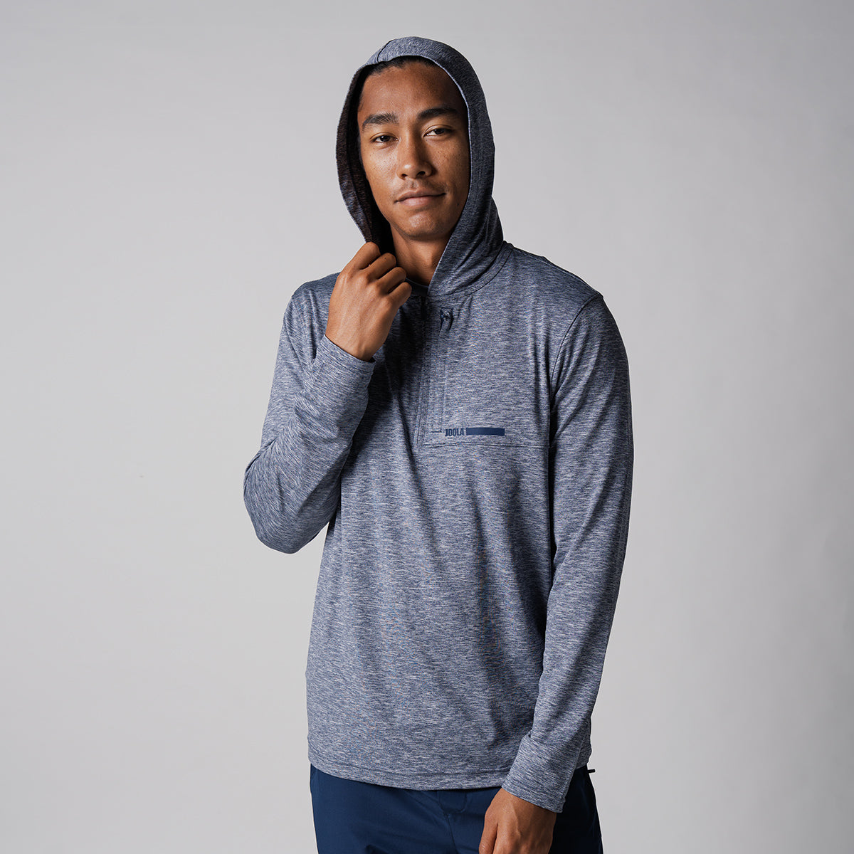 Image of a male model with his hood up on the JOOLA Men's Quarter Zip Hoodie, Navy Heather.