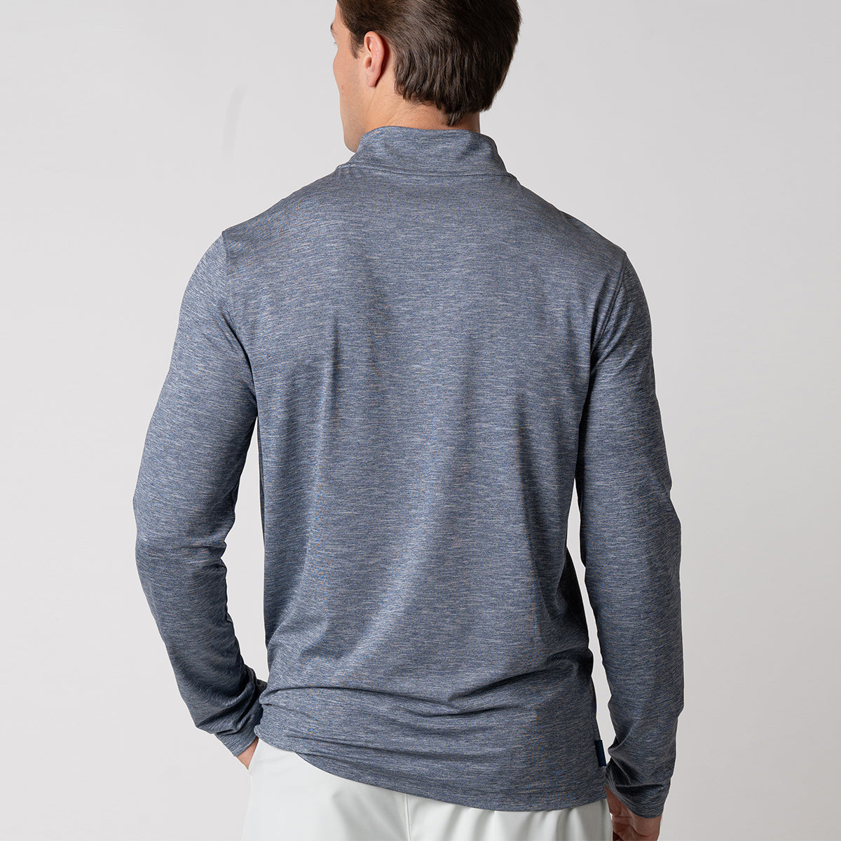 Image of the back of a male model wearing a JOOLA Men's Quarter Zip Pullover, Navy Heather.