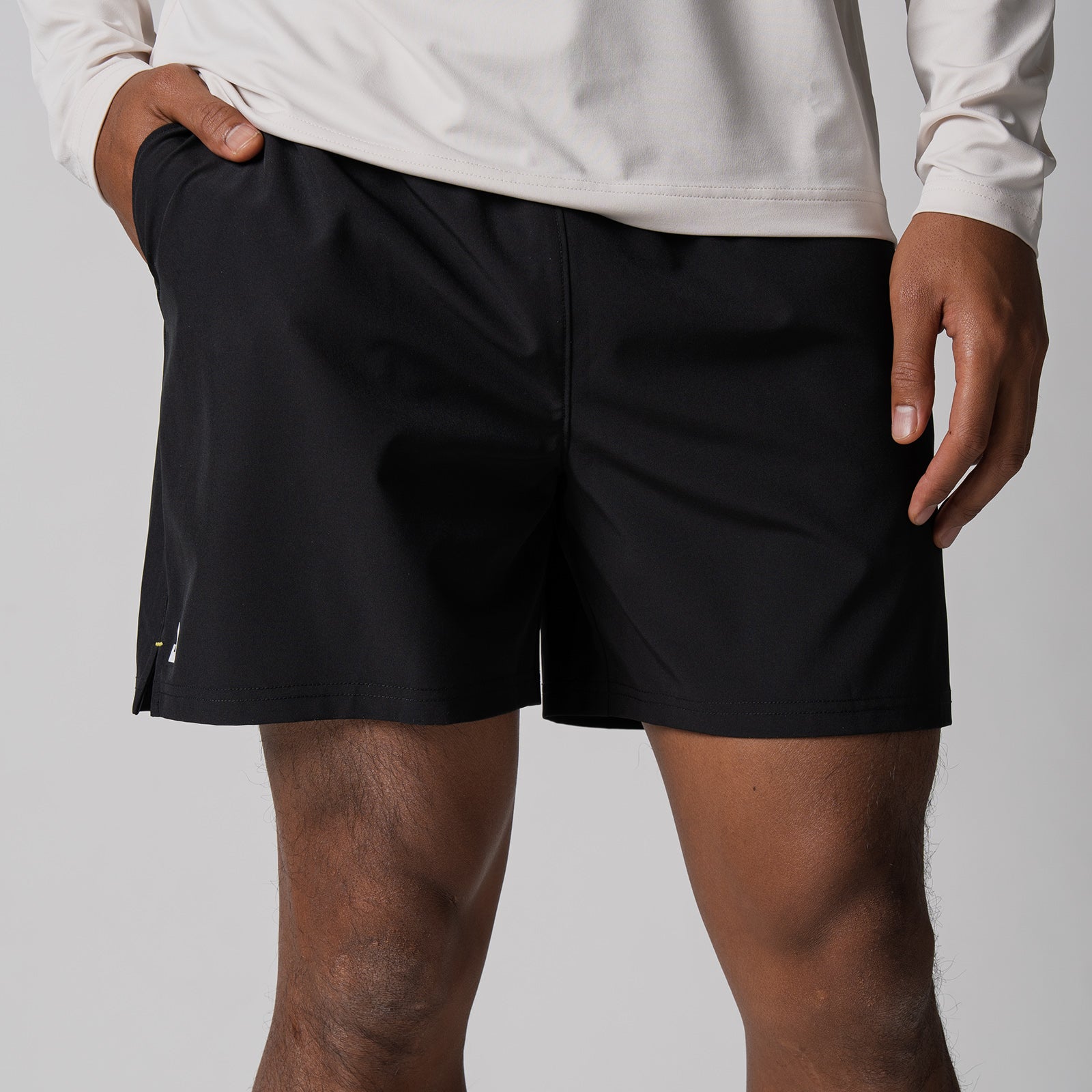 Close up image of a pair of JOOLA Men's Woven Shorts, 5-inch inseam, black.