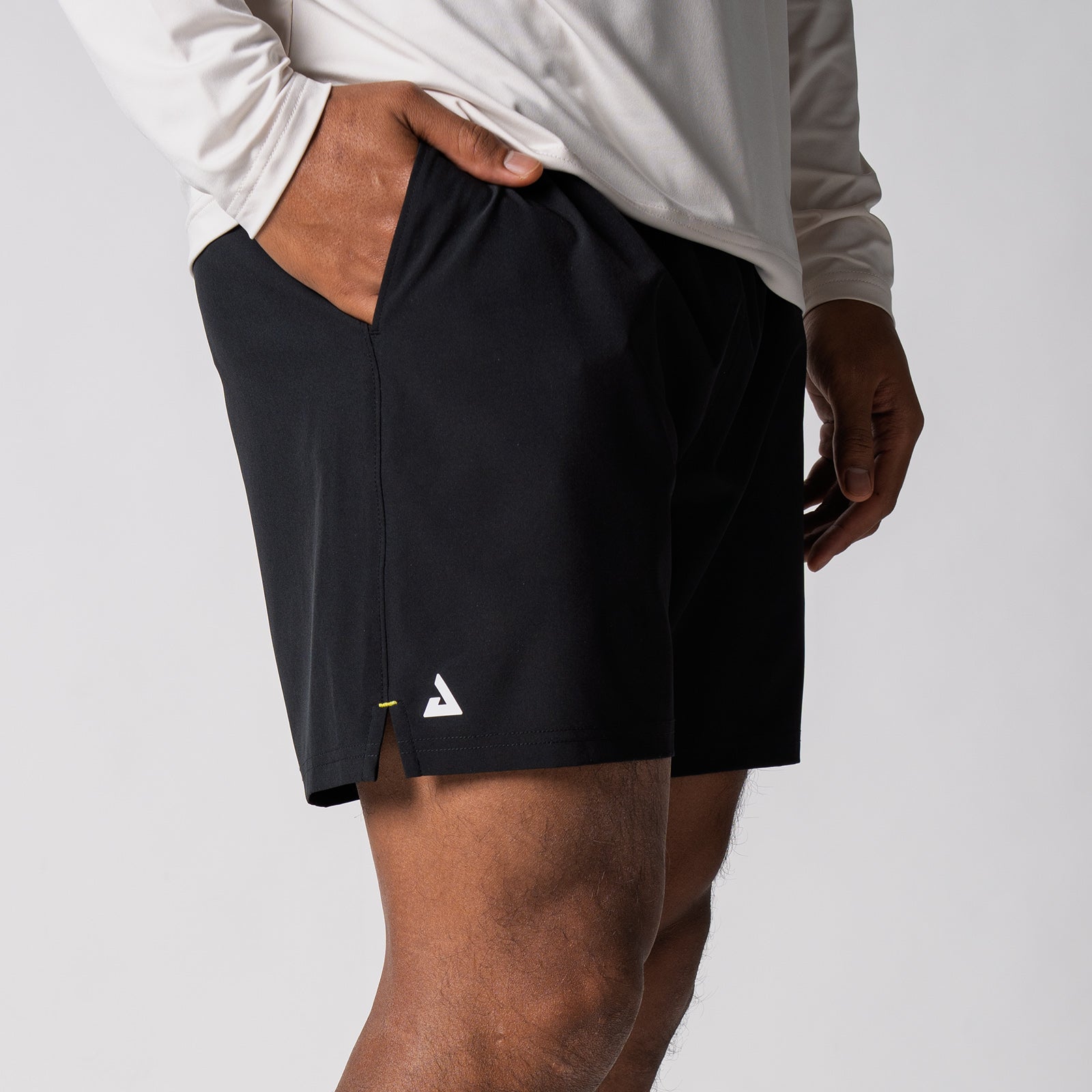 Side view of a pair of JOOLA Men's Woven Shorts, 5-inch inseam, black.