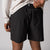 Close up image of the back of a pair of JOOLA Men's Woven Shorts, 5-inch inseam, black.