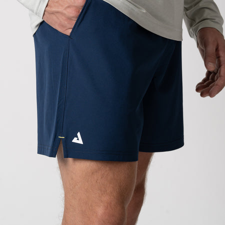 Side view of a pair of JOOLA Men's Woven Shorts, 5-inch inseam, navy.