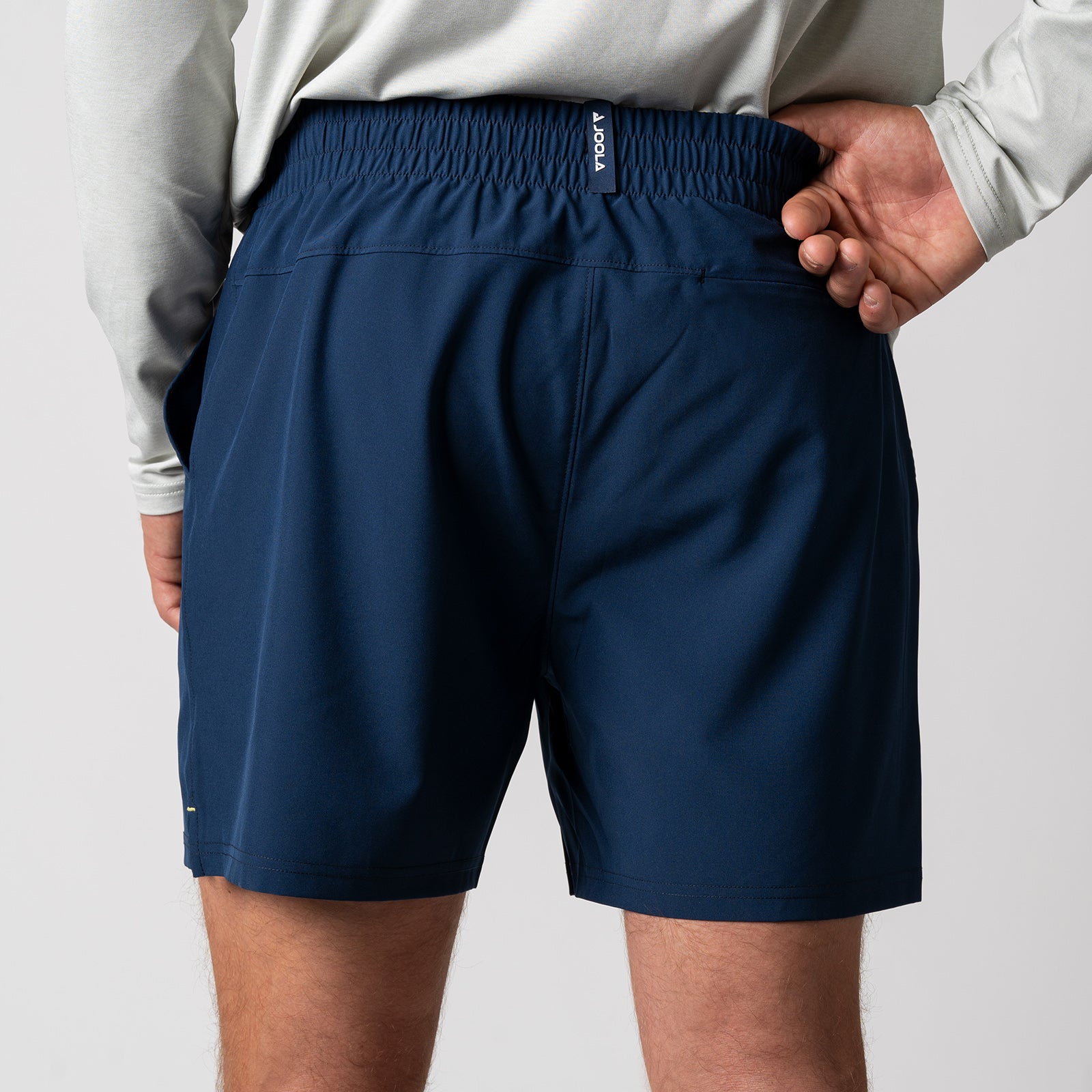 Close up image showing the back of a pair of JOOLA Men's Woven Shorts, 5-inch inseam, navy.