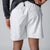 Close up image of the back of a pair of JOOLA Men's Woven Shorts, 5-inch inseam, white.