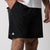 Close up image of the JOOLA Men's Women Shorts, 7-inch inseam, black with white JOOLA trinity logo.