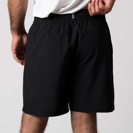 Close up image of the back of a pair of JOOLA Men's Woven Shorts, 7-inch inseam, black.