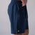 Close up image the side of a pair of JOOLA Men's Woven Shorts, 7-inch inseam, navy.