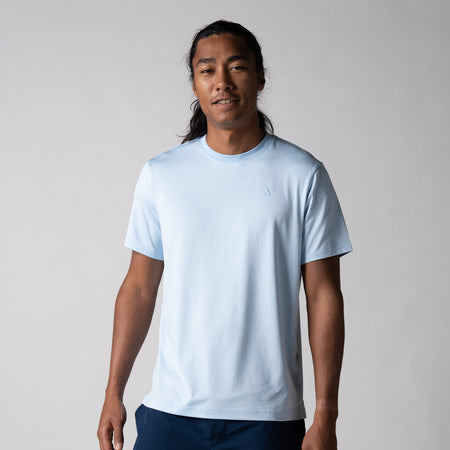 Gray background, image of male model wearing a JOOLA Men's Club Short Sleeve, Blue Breeze.