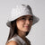 Close up image of a female model wearing a 2025 Unisex Reversible Bucket hat.