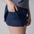 Close up image of the undershorty pocket of a JOOAL Women's Club Skort, Navy.