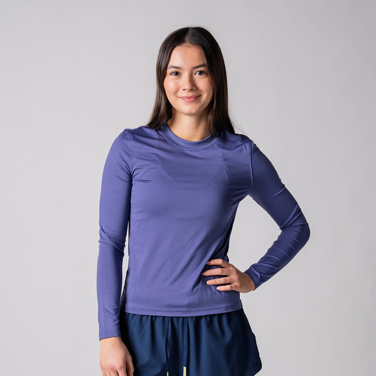 Image of a female model wearing a JOOLA Women's Court Long Sleeve Shirt, Purple Dusk.