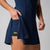 Image of a female model wearing a JOOLA Women's Court Racerback Dress, Navy.