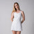 Image of a female model wearing a JOOLA Women's Court Racerback Dress, white.