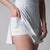 Close up image of the under pocket in the JOOLA Women's Court Racerback Dress, white.