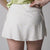 Image of the back of a JOOLA Women's Pickleball Printed Skort, Serpentine White Patterned. 