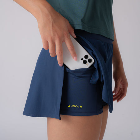 Close up image of the pocket in the undershorty of a JOOLA women's pickleball skort, navy.