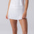 Image of a female model wearing a JOOLA Women's Pickleball Skort, White.