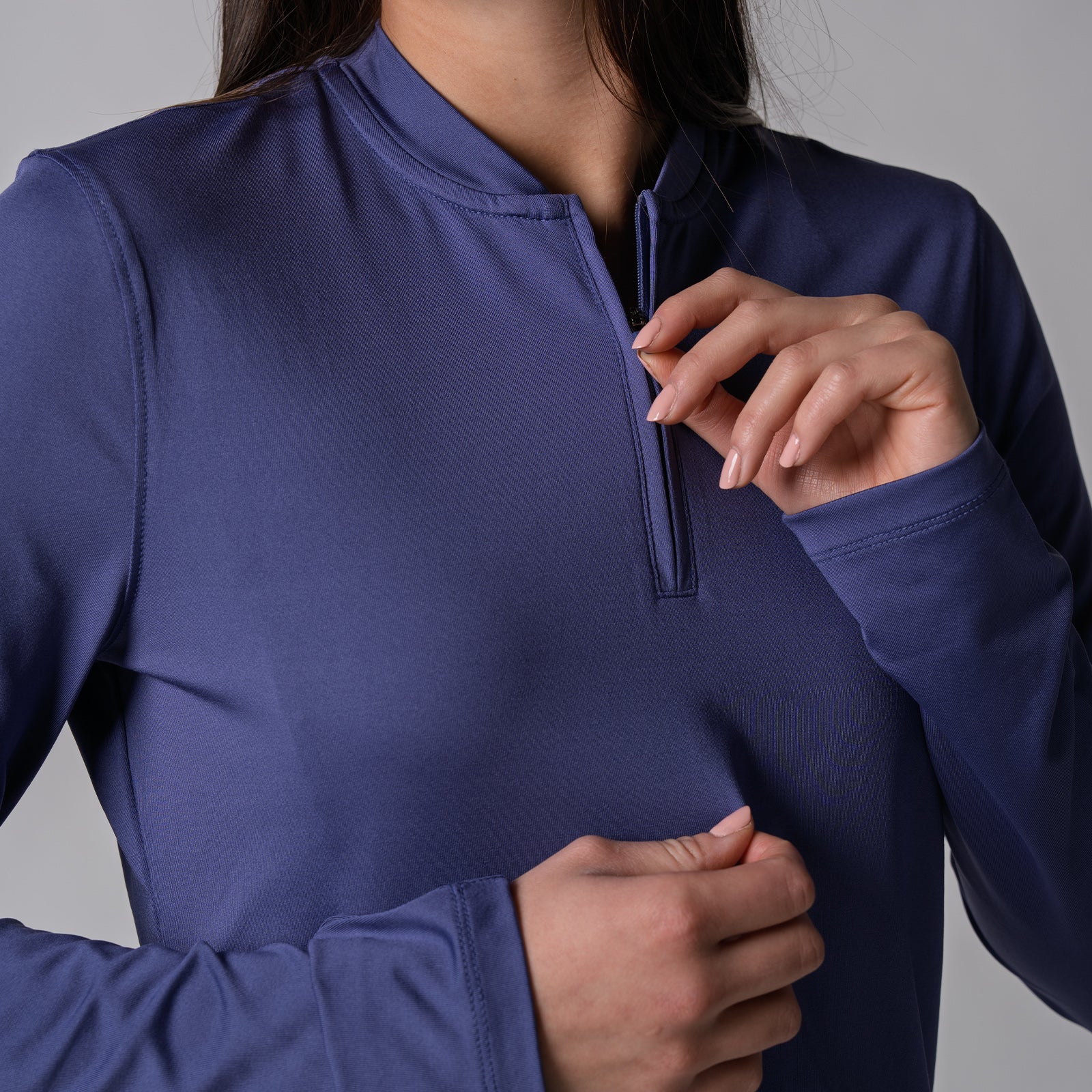 Close up image of zipper on a JOOLA Women's Quarter Zip Pullover, Purple Dusk.