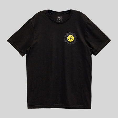 Gray background, black JOOLA graphic tee with yellow pickleball over the left breast.