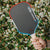 Man holding a JOOLA Perseus Pro V Rally Rocket pickleball paddle in his hand.